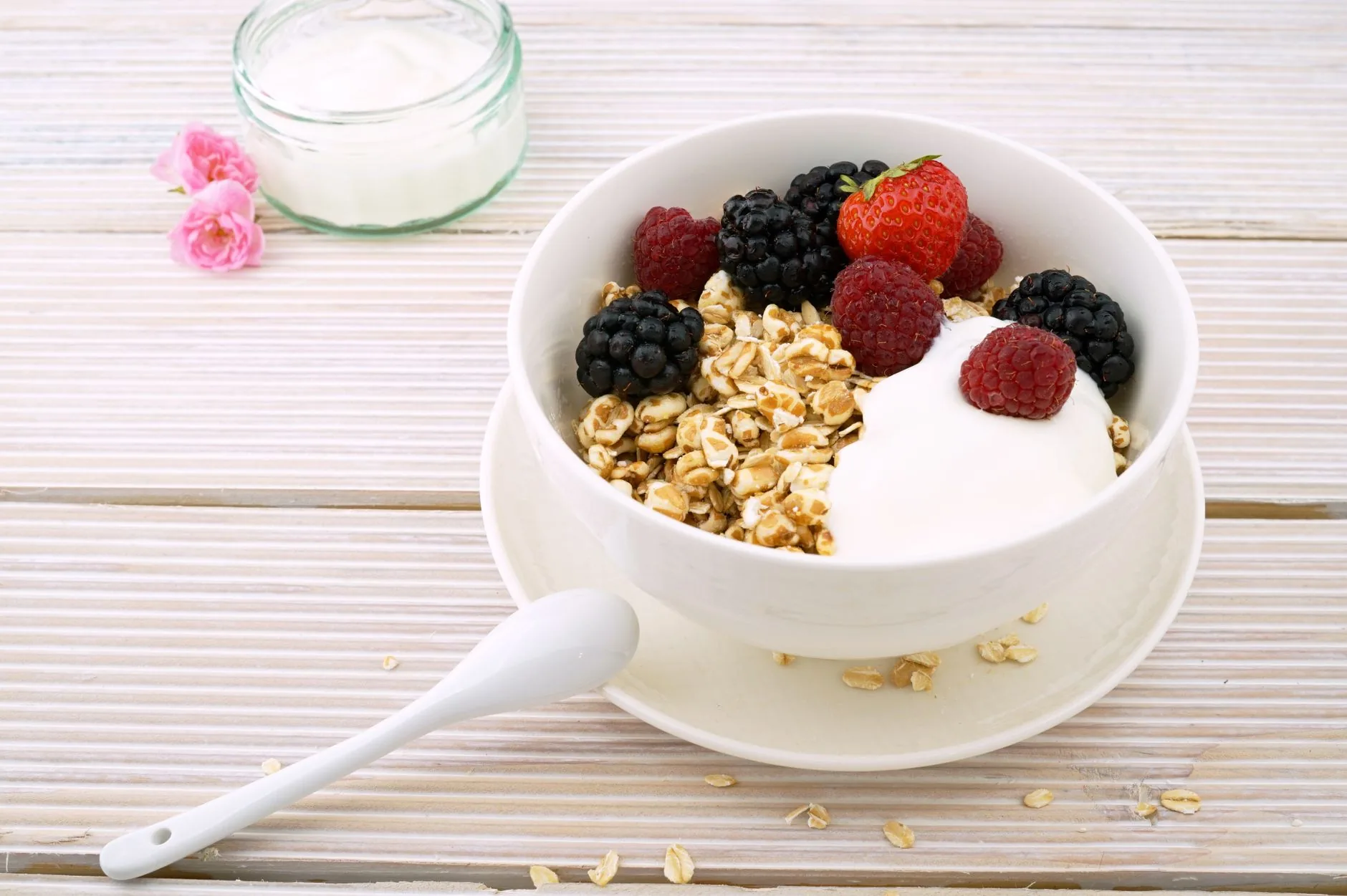 A sunny kitchen with a bowl of Bircher muesli on a table. Jamie Oliver Bircher Muesli Recipe