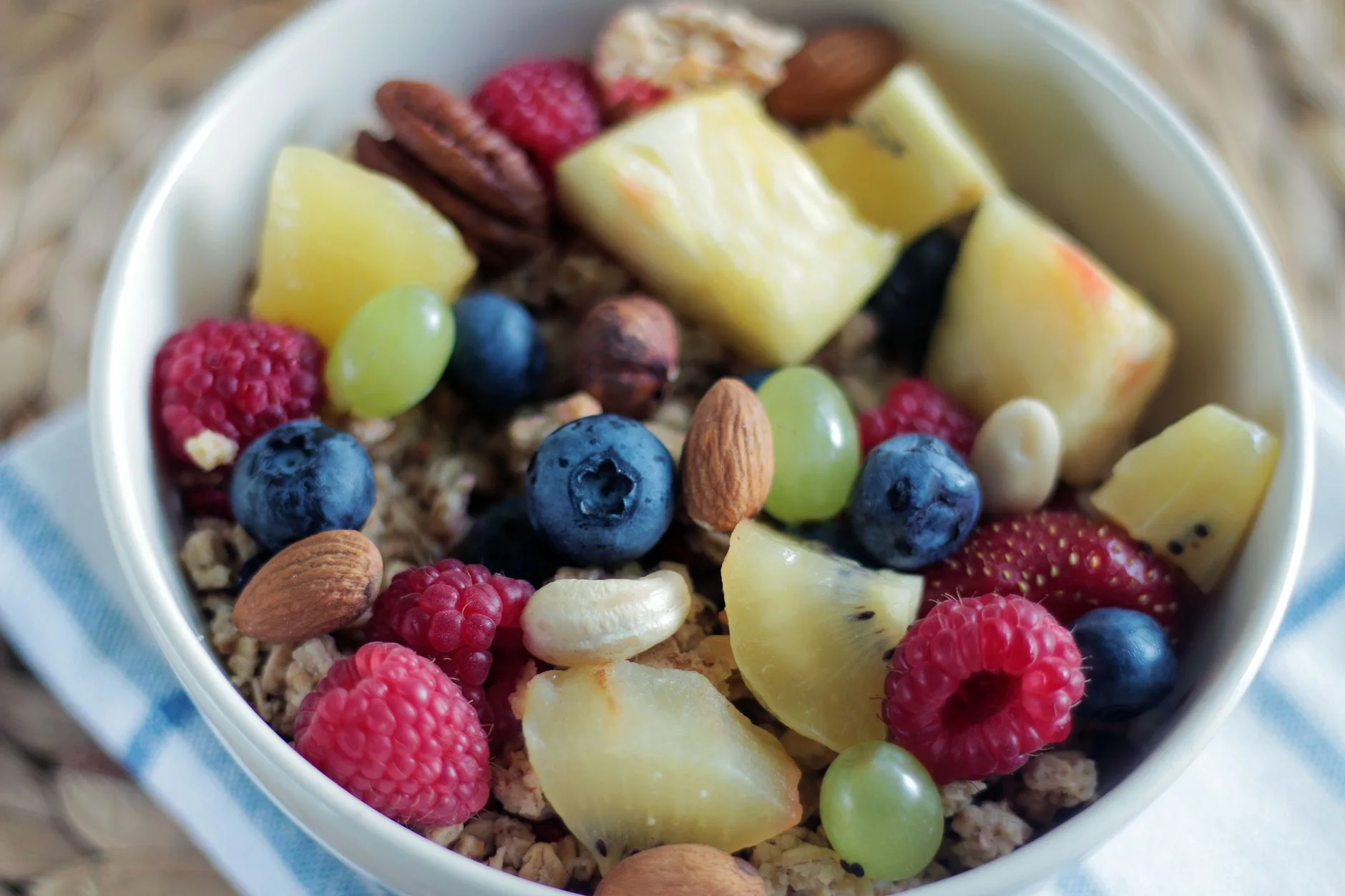 Morning light on rustic table with overnight oats apple cinnamon bowl.