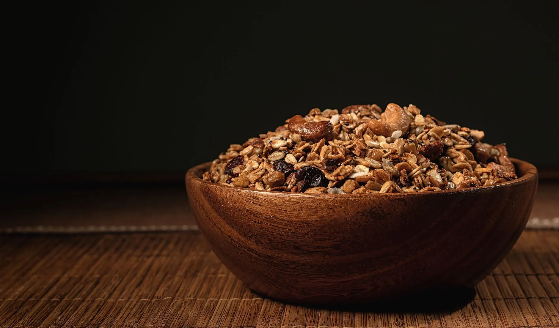 A kitchen counter with overnight oats ingredients and measuring tools in morning light.