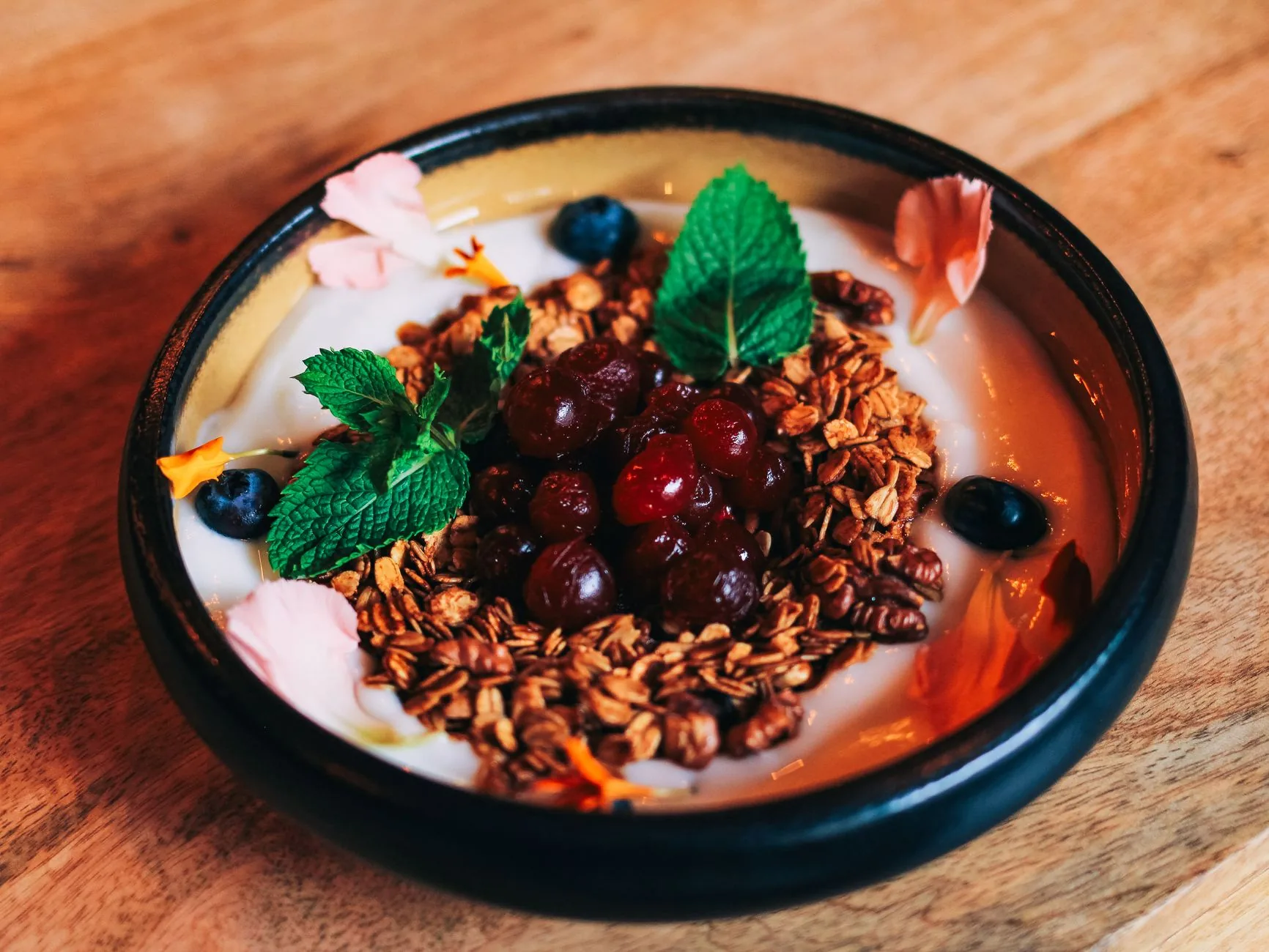 Overnight oats with peanut butter in a jar on a wooden table at dawn.
