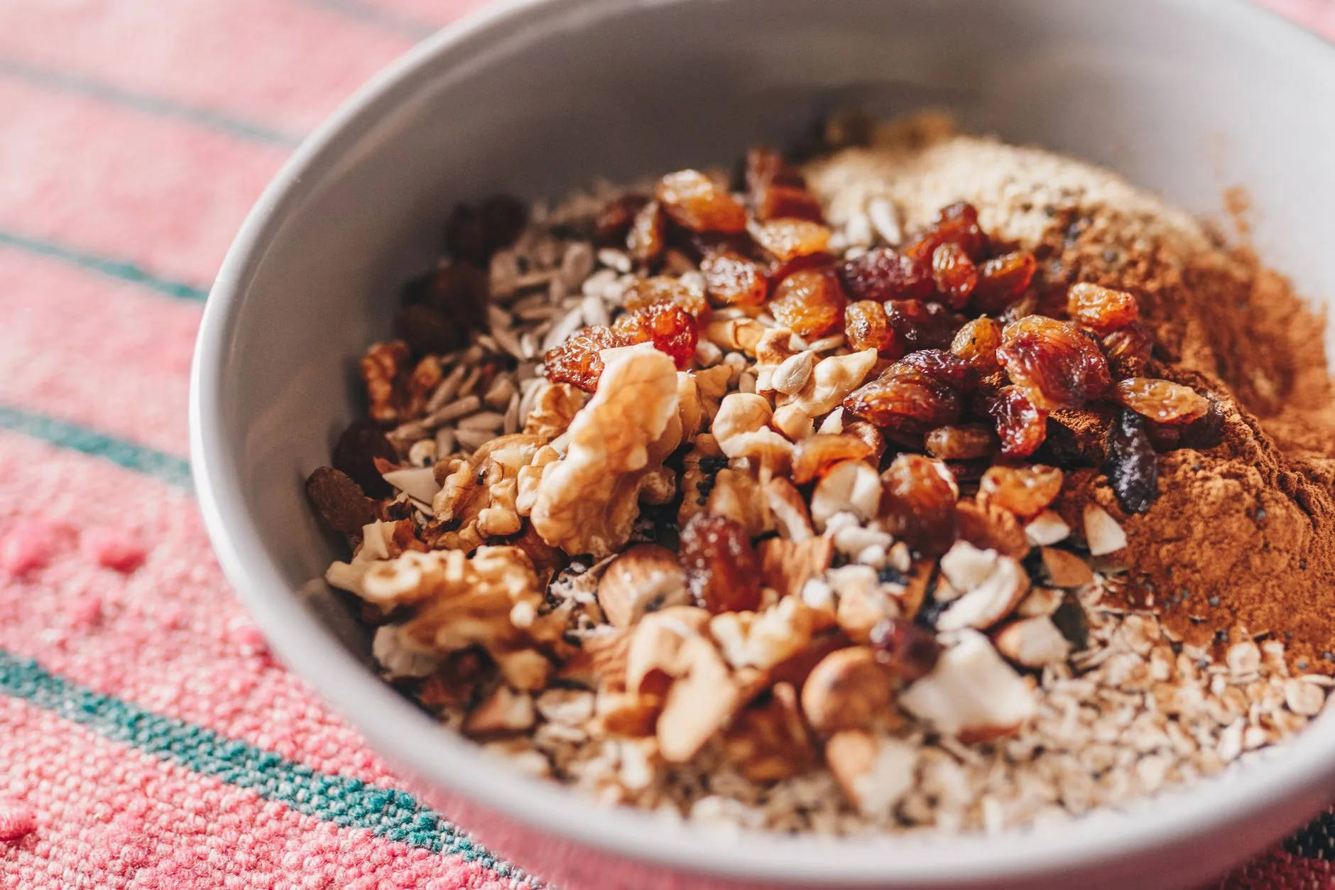 Sunlit breakfast nook with Rude Health Bircher Muesli in a glass jar.