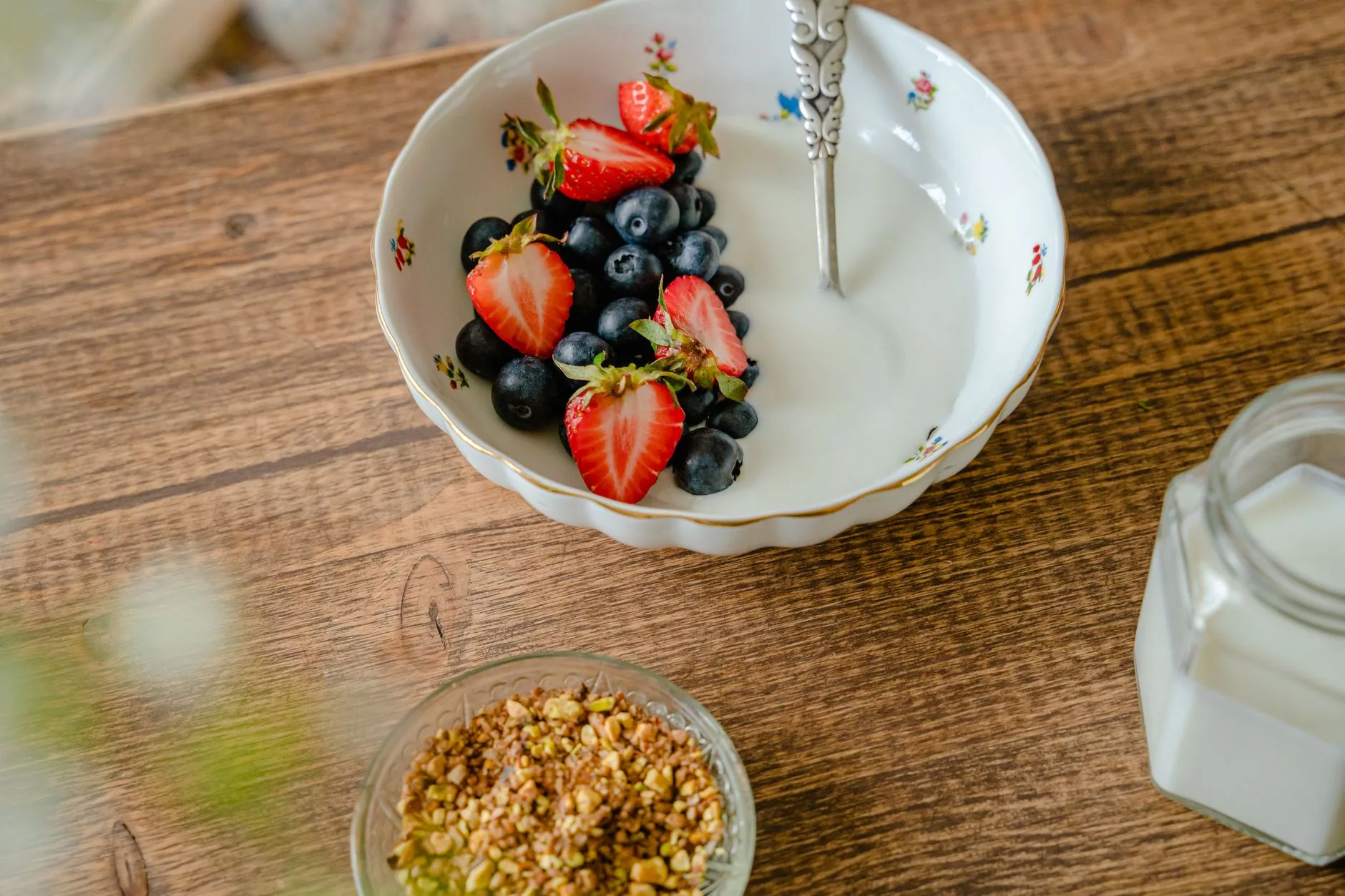 A glass jar of Tesco Bircher Muesli in a sunlit, empty kitchen.
